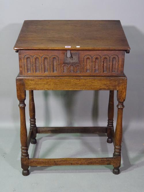 A 17th century style oak slope front bible box, on turned stand, 68cm wide x 96cm high.  D6
