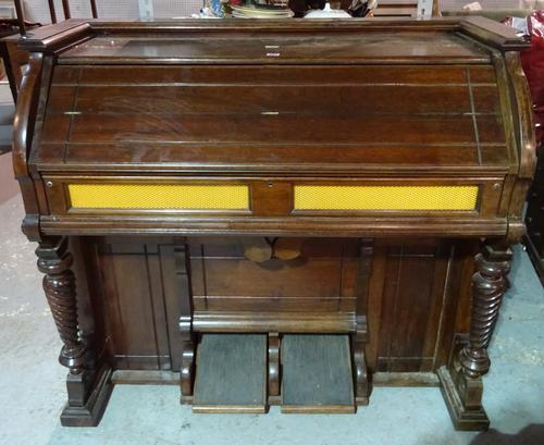An early 20th century mahogany pump organ, 131cm wide x 112cm high.  BAY 1