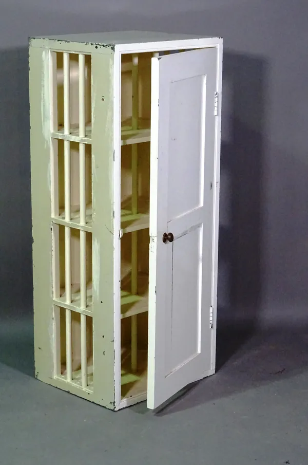 A 20th century white painted shoe cupboard, 43cm wide x 102cm high.  A9