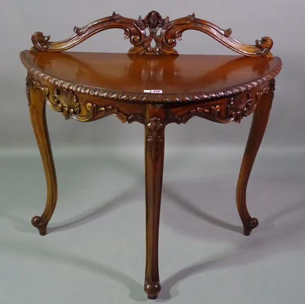 A 20th century carved hardwood demi-lune side table, 88cm wide x 89cm high  F5