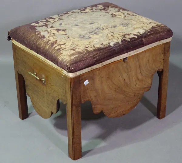 A George III mahogany rectangular footstool with lift top seat, 56cm wide x 45cm high and a George III circular wine table on three downswept supports