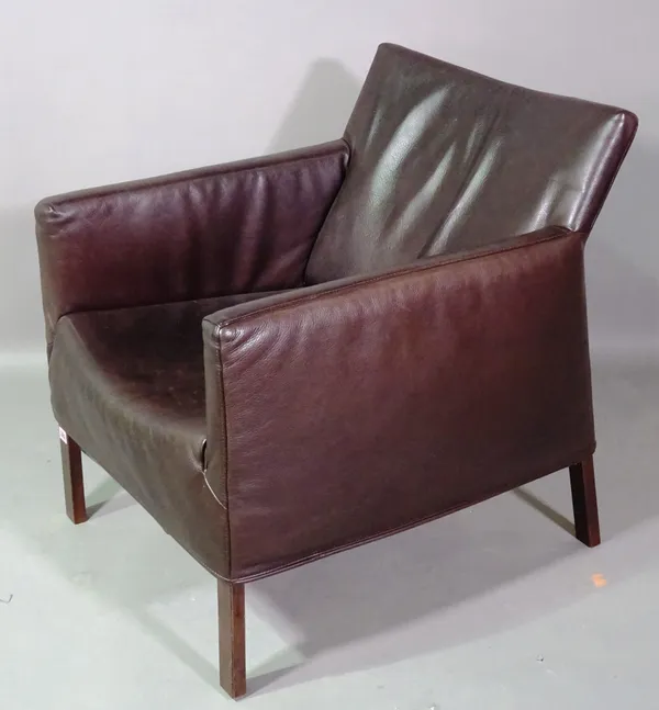 A 20th century hardwood framed armchair with faux black leather upholstery.  B7