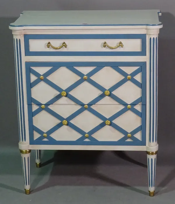 A 20th century blue and white painted drawer chest with lattice decorated drawers on fluted tapering supports, 70cm wide x 85cm high.   C5