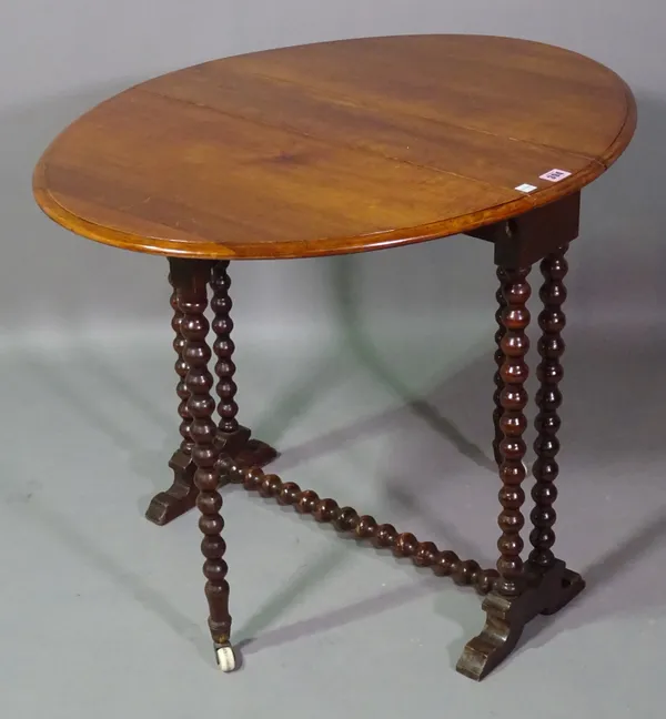 A Victorian mahogany Sutherland table on bobbin turned supports, 65cm wide x 63cm high.   G6