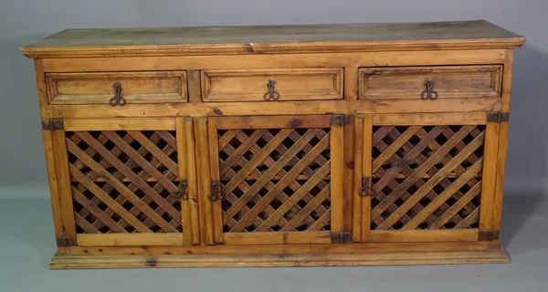 Tucan; a 20th century hardwood sideboard with three drawers over lattice panel doors, 163cm wide x 78cm high.   G9