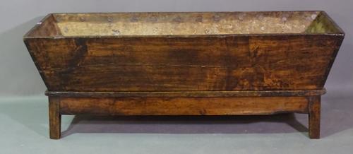 An 18th century and later oak dough bin on block supports, 152cm wide x 54cm high.   H5