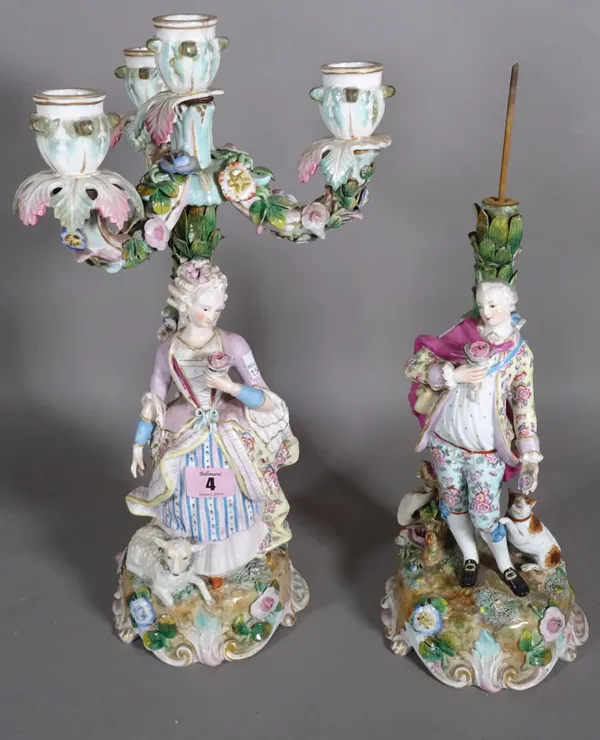 A pair of Continental figural porcelain candelabra, one lacking sconces, 34cm high (2).  CAB