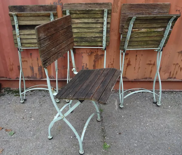 A set of four 20th century white painted folding cafe chairs, (4).  OUT