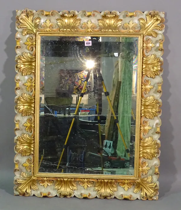 A 20th century Italian style gilt framed rectangular mirror with scroll decoration, 70cm wide x 93cm high.   D6