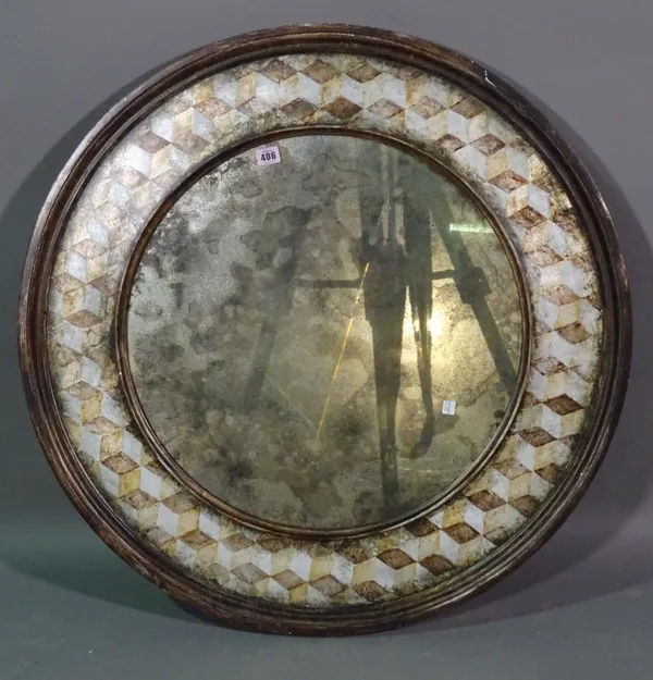 A 20th century circular mirror with painted parquetry decoration, 85cm wide.   A9