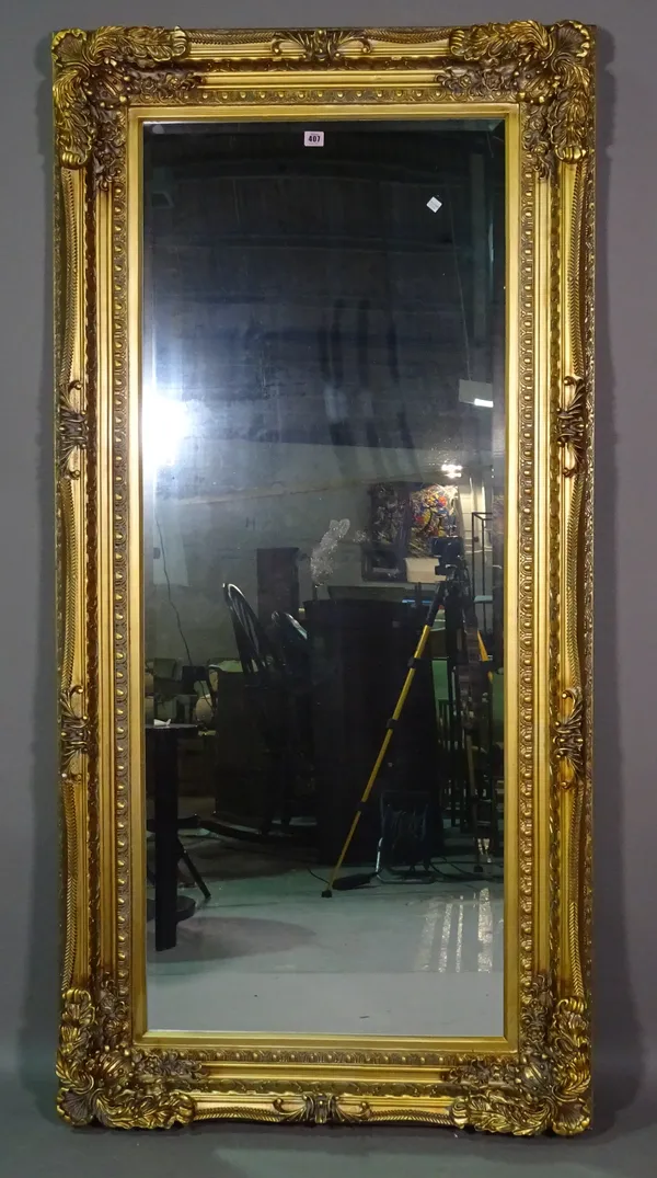 A 20th century gilt framed rectangular mirror with acanthus decoration, 180cm wide x 86cm high.  B10