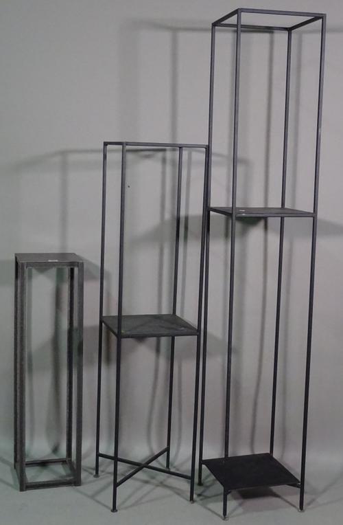 A group of four 20th century black metal jardiniere stands, the tallest, 28cm wide x 160cm high, (3).  BAY 1