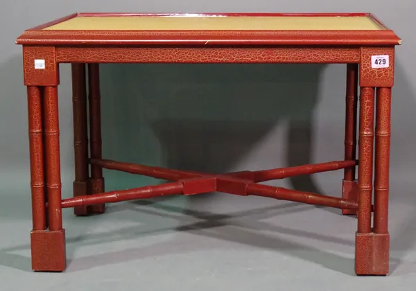 A 20th century red lacquer and faux shagreen rectangular coffee table on block supports, 71cm wide x 49cm high.   I6