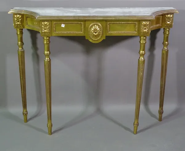 A 20th century giltwood concave console table with inset mirrored top on fluted tapering supports, 112cm wide x 83cm high.   F9