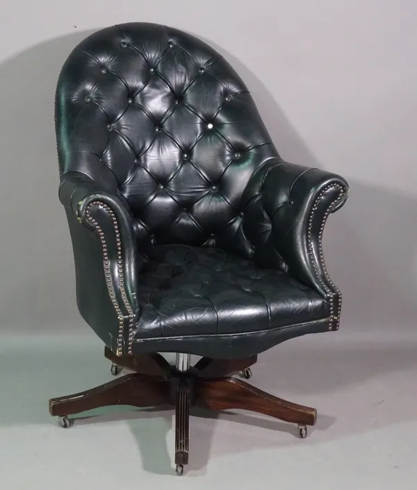 A 20th century mahogany framed tub back office armchair with black leather upholstery.   K8