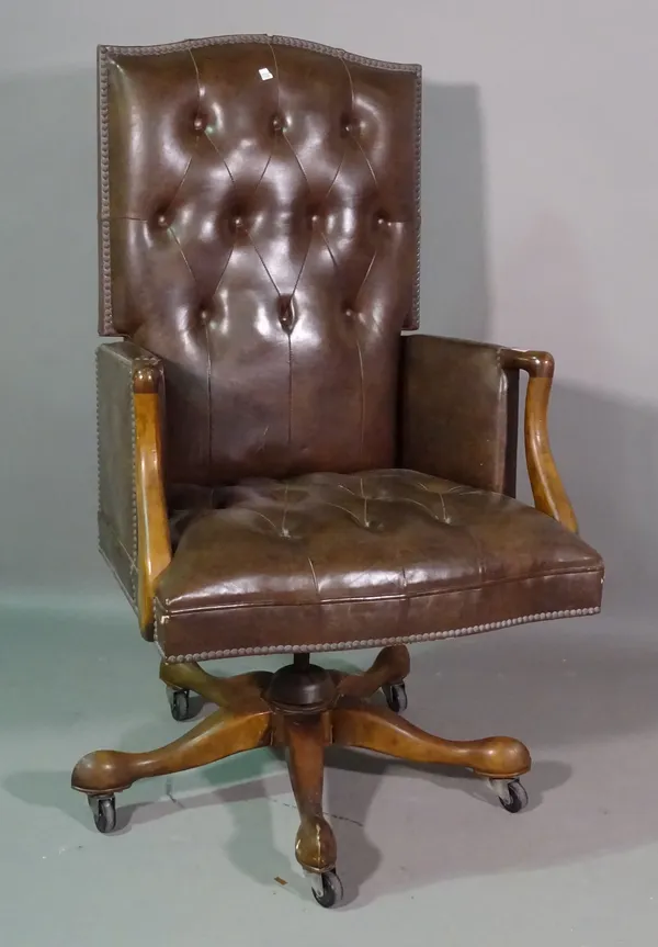 A 20th century mahogany framed button back brown leather office armchair.  K8