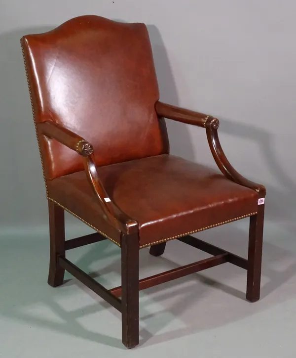 A Gainsborough style mahogany framed open armchair with studded red leather upholstery.   A3