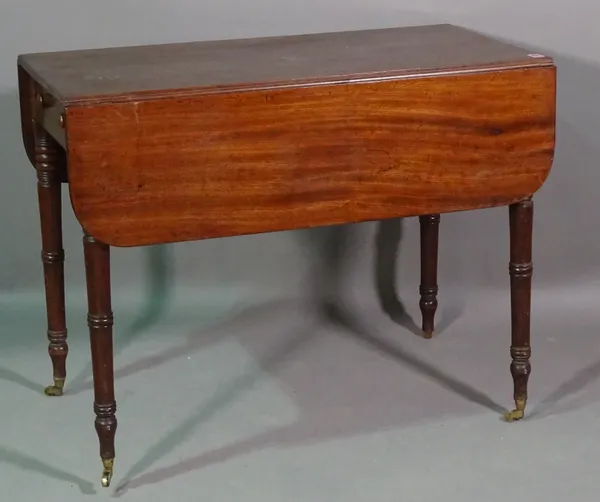 A George III circular mahogany tripod table, 64cm wide x 68cm high and a George III mahogany Pembroke table, 91cm wide x 70cm high (2).  BAY 1