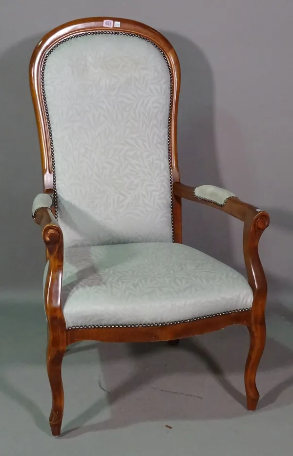 A 20th century mahogany framed spoonback open armchair.   J7