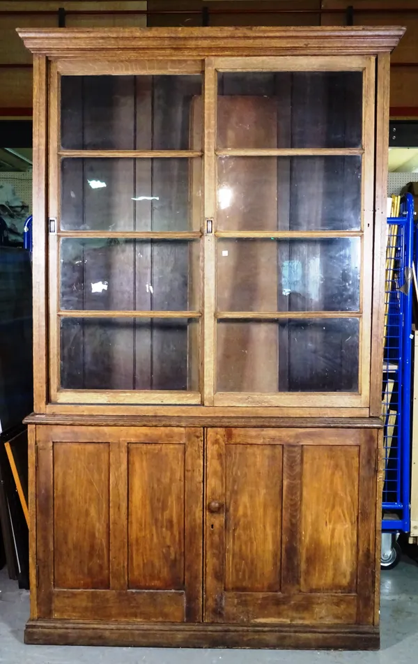 An 18th century oak bookcase with pair of cupboards, 137cm wide x 220cm high.   M9