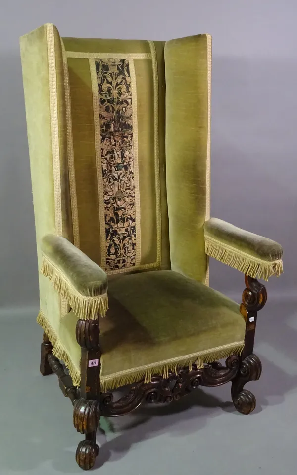 A 17th century Flemish style high square wingback armchair with pierced and carved lower frieze on scroll supports, 73cm wide x 130cm high.   F6