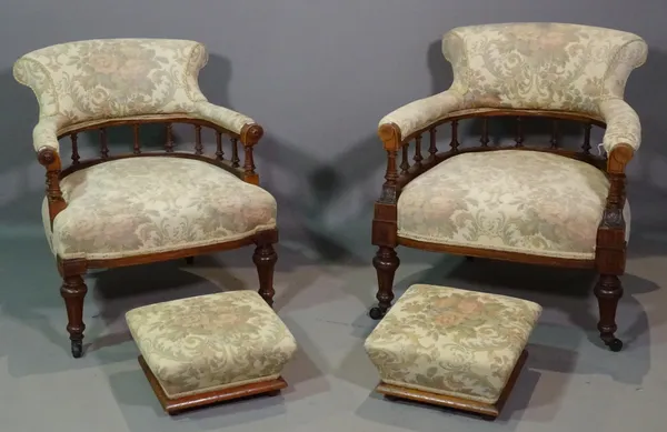A pair of Victorian mahogany framed low tub chairs and matching footstools, (4).  H8
