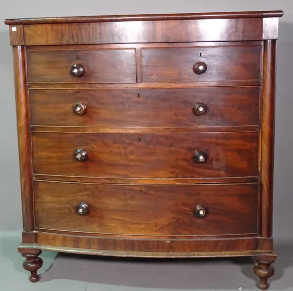 A Victorian mahogany bowfront chest with secret drawer over two short and three long graduated drawers, flanked by split turned columns, 123cm wide x