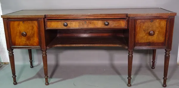 Gillingtons of Dublin, a mid-19th century mahogany sideboard, the inverted breakfront with single frieze drawer flanked by cupboards on tapering reede