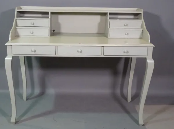A 20th century grey painted desk with three drawers on cabriole supports, 125cm wide x 104cm high.  H6
