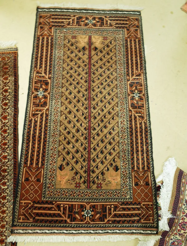 Two small rugs with brown fields, the first with peacocks and hares, the second with stag leaf and leaf design, the larger 165cm x 86cm, (2).    I8 48