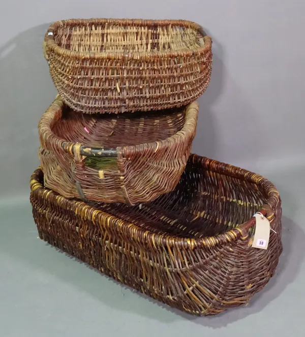 A group of three wicker trugs, the largest 90cm wide x 33cm high.   F10