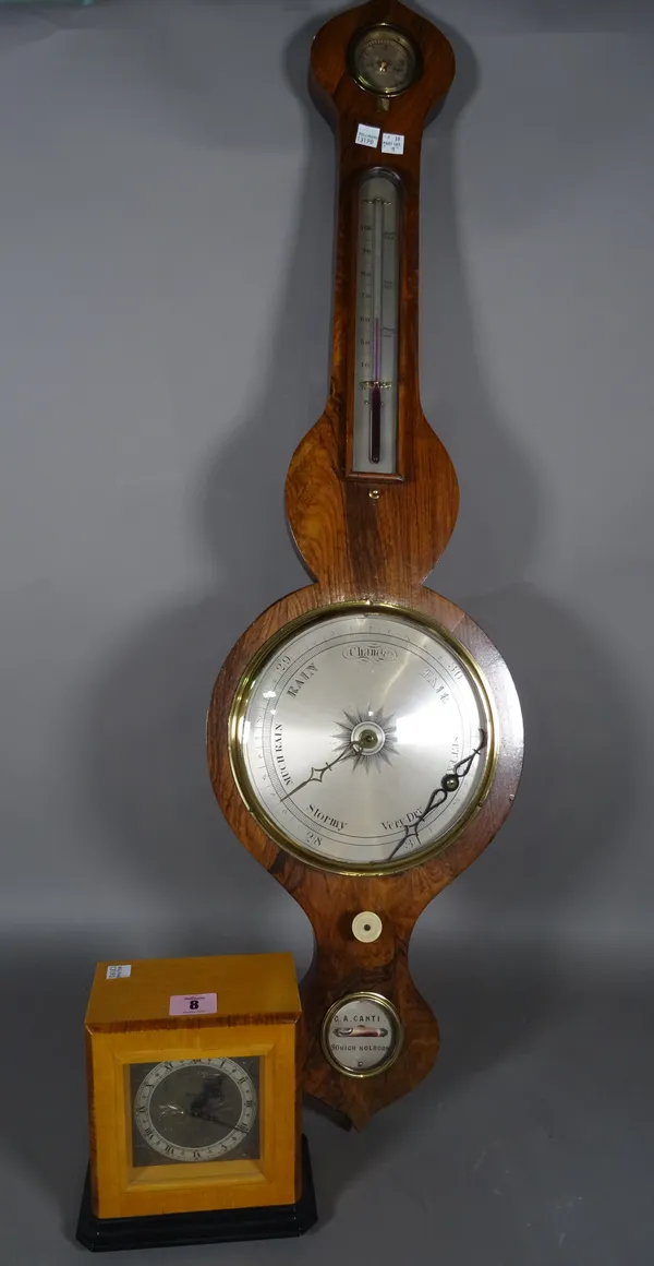 Rotherham; a 20th century satinwood cased mantel clock on ebonised plinth base, 14cm wide x 17cm high and an early 20th century rosewood barometer, 97