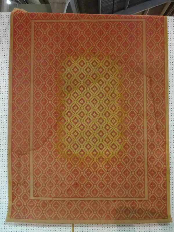 A 20th century red and cream embroidered rug.   BAY 2