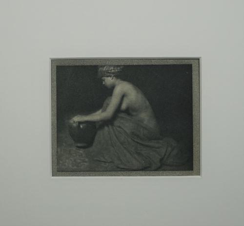 ALVIN LANGDON COBURN  (1882 - 1966)  The Water Carrier, 1913.  photogravure of a woman kneeling with an urn, ca. 1913, inscribed within the book plate