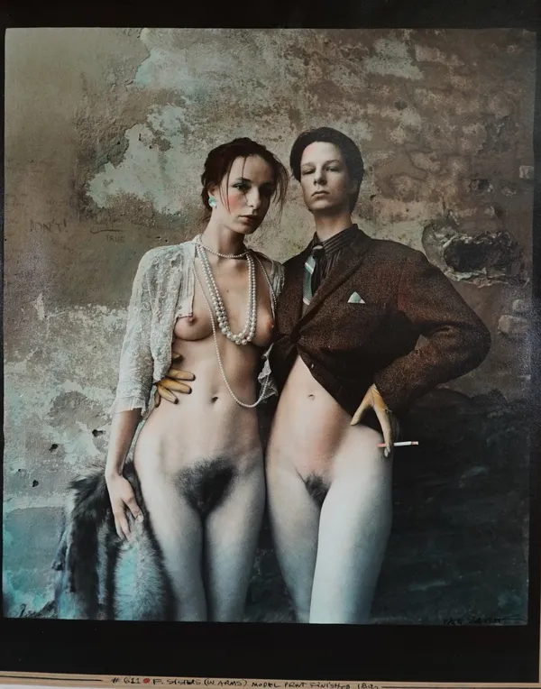 JAN SAUDEK  (b. 1935)  F- Sisters (in arms), 1990.  hand-coloured, gelatin silver print, mounted, signed by  photographer in ink lower r.h, ms. captio