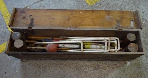 A late 19th century croquet set within a pine case.