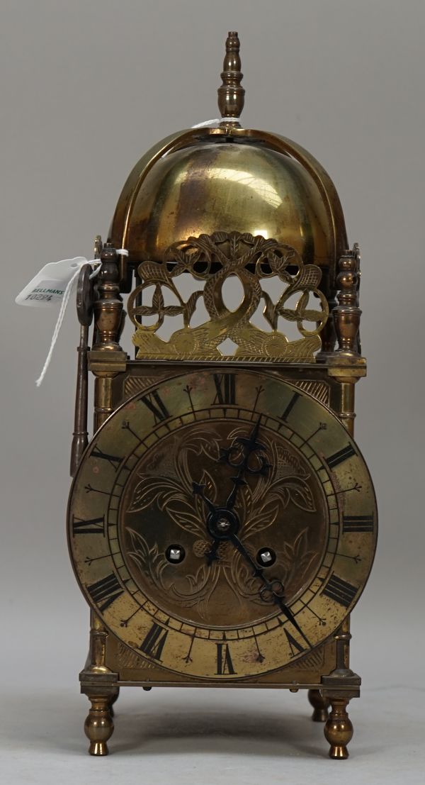 A 19th century brass lantern clock enclosing a French two train movement, 31cm high. (key)