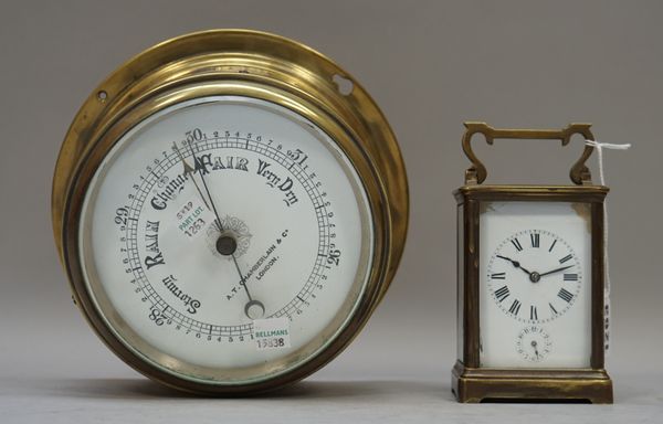 A French R & C brass cased carriage clock, 11.5cm high, and a brass cased Capstan wall barometer by A.T. Chamberlin & Co, London with a six inch ename