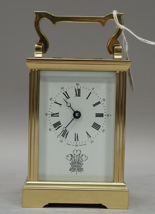 An English brass carriage timepiece, 20th century, presentation engraving of His Royal Highness Prince of Wales feathers, retailed by Garrards, 14.9cm