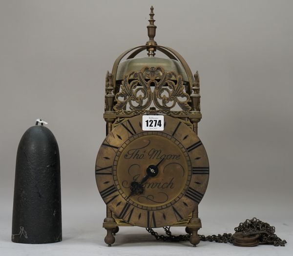 A 20th century brass lantern clock, engraved to the dial 'Thos Moore Ipswich' with weight driven movement, 36cm high, (cast iron weight, two keys and