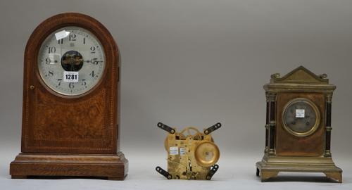 A Bulle patent mantel clock, early 20th century, the domed oak inlaid case enclosing an unusual movement, 36cm high; a mahogany drop dial wall clock,