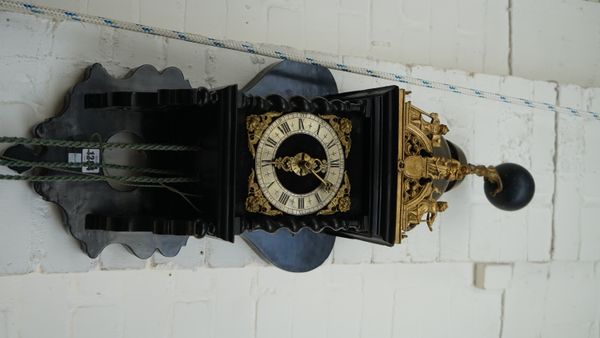 A Dutch 'Zaan' wall clock, 18th/19th century, with ebonised shaped oak case and quarter striking movement, four graduated brass weights, one pendulum,