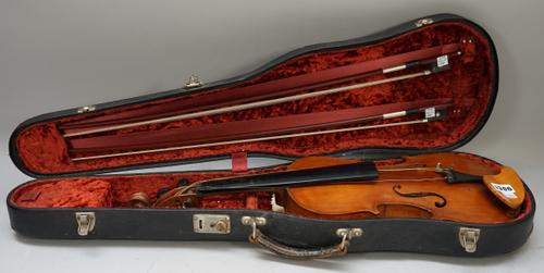 A violin, interior label reads 'Joseph Ceruti Filius Baptiste Fecit ad Imitatonem Straduvari Cremone 1806', back measures 14 inches, with two bows and