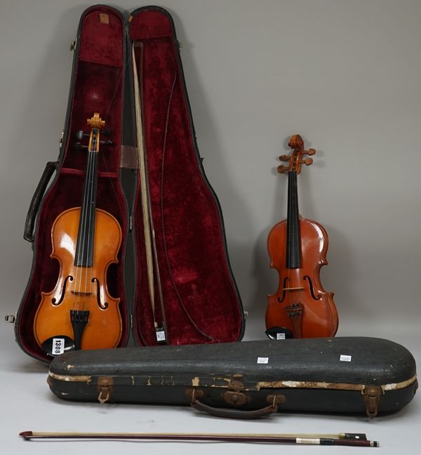 A violin, interior label detailed 'JTL Mansuy a Paris' with 12 1/4 inch back, bow and hardcase and one smaller violin, the label detailed 'Neuner und