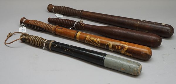 A 'Mcnaughton' hardwood police truncheon stamped 'MCNAUGHTON GLASGOW', 45cm, another Victorian truncheon with gilt 'VR' and two further truncheons, (4