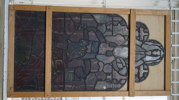 Three Victorian stained glass panels, each depicting a central figure within a shaped border, the tallest, 126cm high, (3).