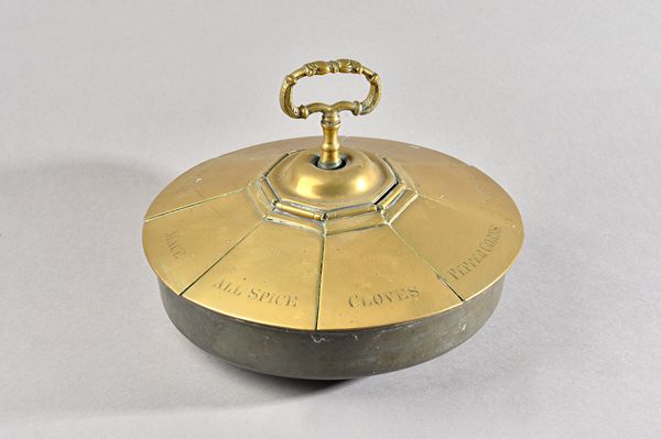 A Victorian 'Country House' brass spice and kitchen ingredients circular box, the cover in eight sections variously engraved and with cypher DBFL bene