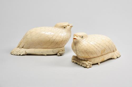 A pair of 19th century Chinese ivory quail box and covers, each naturalistically hollowed and carved with a resting quail, the body and wings forming