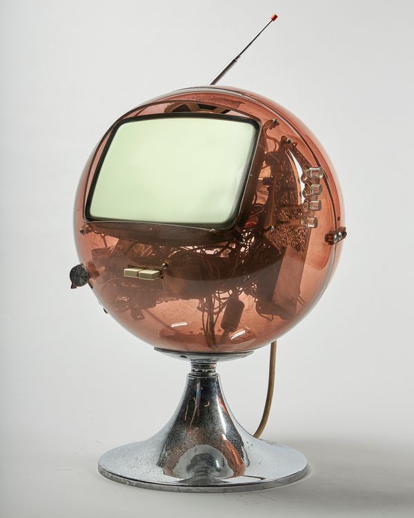 A 1970's (?) perspex cased television of globular translucent "Sputnik" form, on a circular chrome foot, 46cm high.  Illustrated