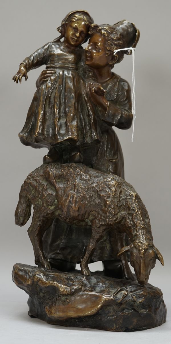 After Joseph D'Aste (French 1881-1945), a bronze figural group, circa. 1910, depicting Dutch mother and child, the young girl standing on a sheep's ba